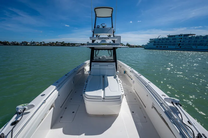Hoosier Hooker Yacht Photos Pics 2021 Invincible 40 Catamaran on water, clear sky, luxury boating experience.
