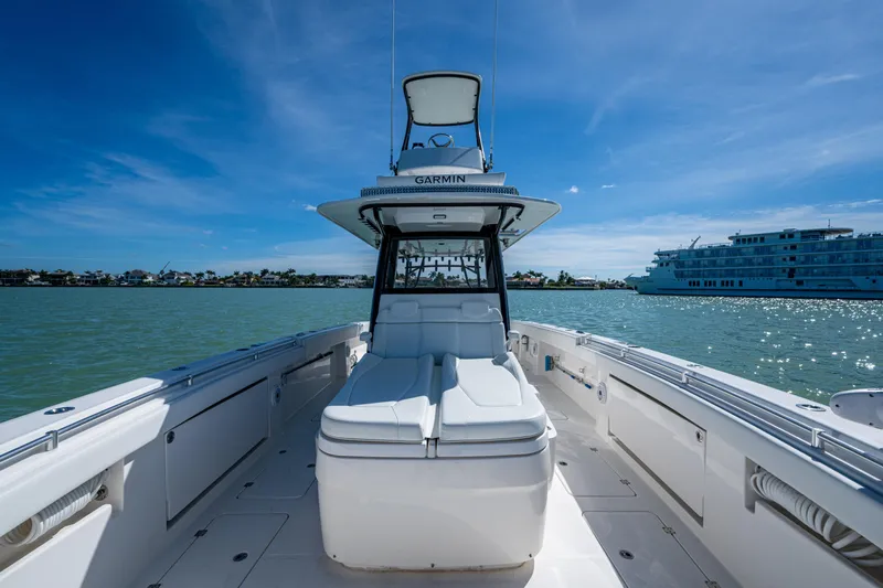 Hoosier Hooker Yacht Photos Pics 2021 Invincible 40 Catamaran on water, clear sky, luxury boating experience.