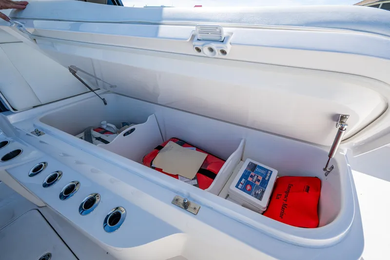 Hoosier Hooker Yacht Photos Pics Open storage compartment on 2021 Invincible 40 Catamaran with emergency marine kit and supplies.