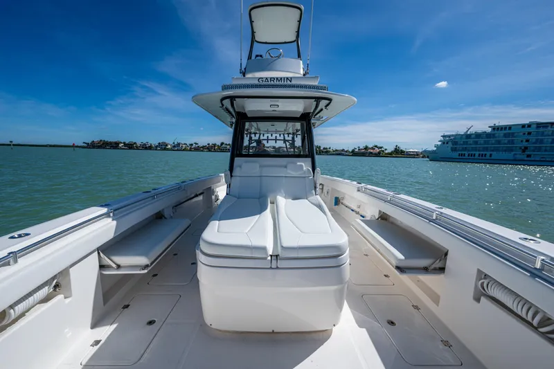 Hoosier Hooker Yacht Photos Pics 2021 Invincible 40 Catamaran on water, showcasing sleek design and spacious deck.