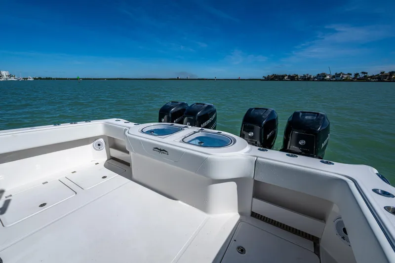 Hoosier Hooker Yacht Photos Pics Invincible 40 Catamaran 2021 with powerful outboard motors on a calm sea.