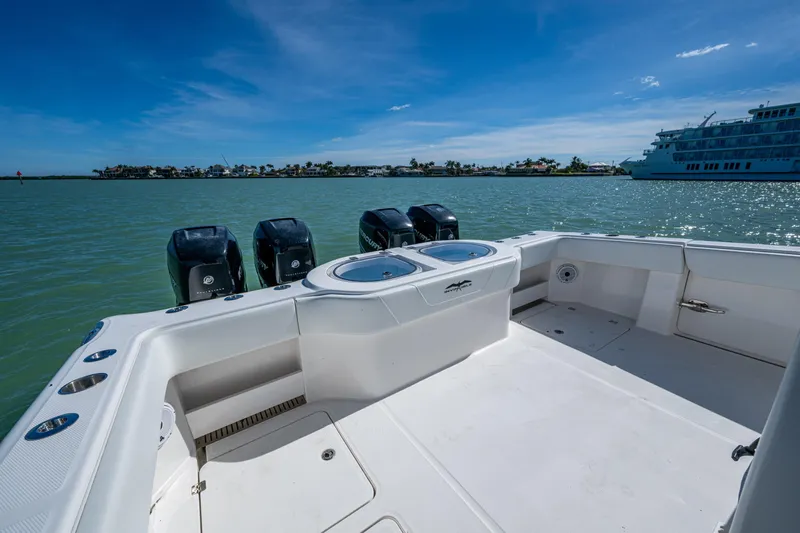Hoosier Hooker Yacht Photos Pics 2021 Invincible 40 Catamaran with four outboard engines on calm water.