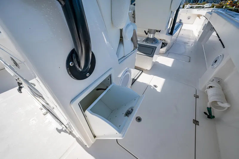 Hoosier Hooker Yacht Photos Pics 2021 Invincible 40 Catamaran interior, showcasing storage compartments and seating area.
