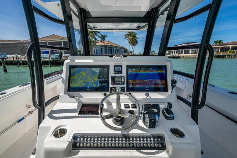 Hoosier Hooker Yacht Photos Pics Cockpit of 2021 Invincible 40 Catamaran with advanced navigation displays and controls.