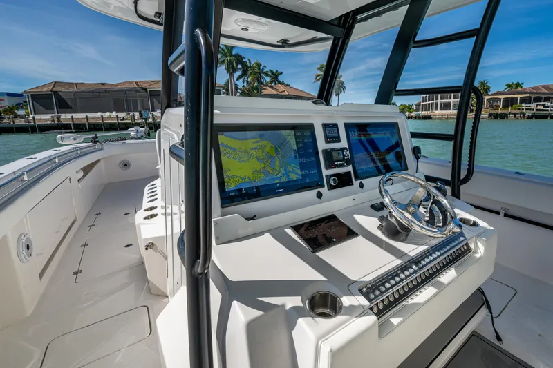 Hoosier Hooker Yacht Photos Pics 2021 Invincible 40 Catamaran cockpit with advanced navigation system and sleek design.