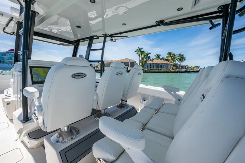 Hoosier Hooker Yacht Photos Pics Interior of 2021 Invincible 40 Catamaran with luxurious seating and waterfront view.