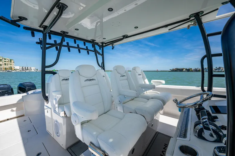 Hoosier Hooker Yacht Photos Pics Luxurious interior of 2021 Invincible 40 Catamaran with white seating and ocean view.