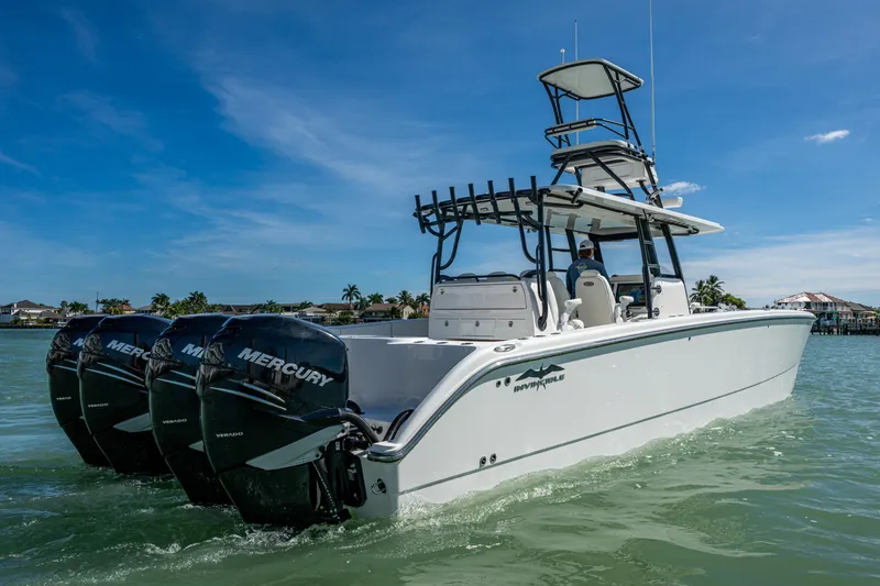 Hoosier Hooker Yacht Photos Pics 2021 Invincible 40 Catamaran with Mercury engines on water, clear sky background.