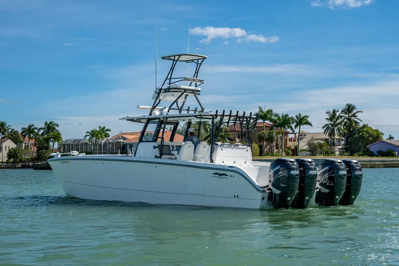 Hoosier Hooker Yacht Photos Pics 2021 Invincible 40 Catamaran with quad Mercury engines on a sunny day.