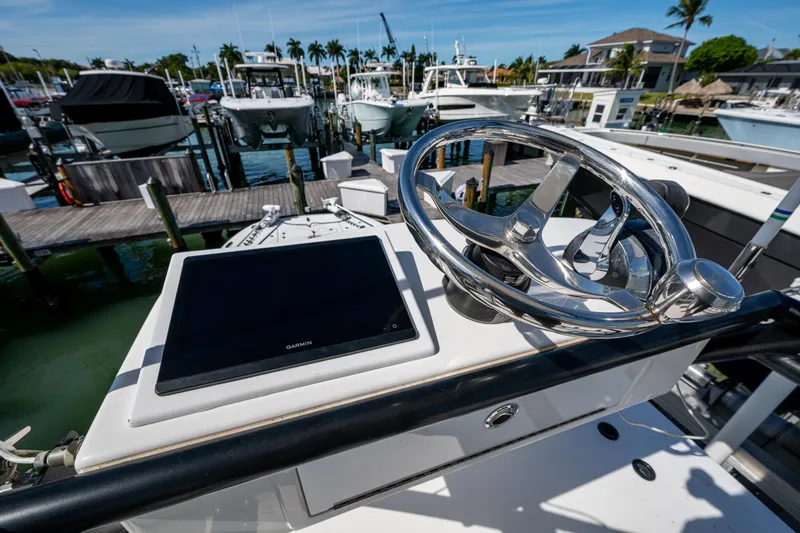 Hoosier Hooker Yacht Photos Pics Helm of 2021 Invincible 40 Catamaran with Garmin display, docked at marina.