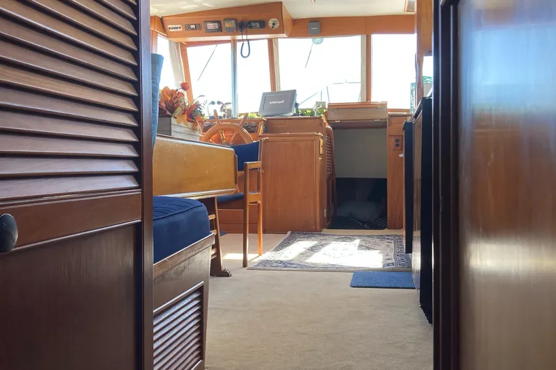  Yacht Photos Pics Interior of 1983 Grand Banks 42 Classic yacht, featuring wooden furnishings and nautical decor.