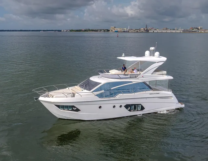 Tara Yacht Photos Pics 2017 Absolute 50 Fly yacht cruising on calm waters under cloudy skies.