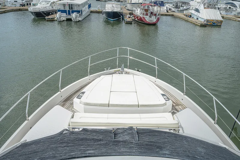 Tara Yacht Photos Pics Bow view of 2017 Absolute 50 Fly yacht docked in a marina.