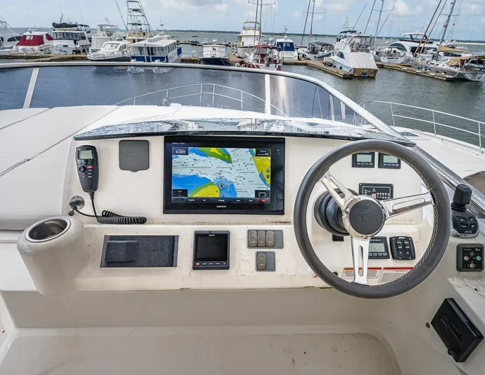 Tara Yacht Photos Pics Cockpit of 2017 Absolute 50 Fly yacht with navigation system and steering wheel.