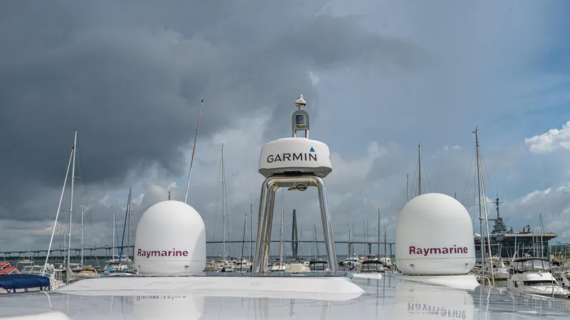 Tara Yacht Photos Pics Radar and navigation equipment on 2017 Absolute 50 Fly yacht under cloudy sky.