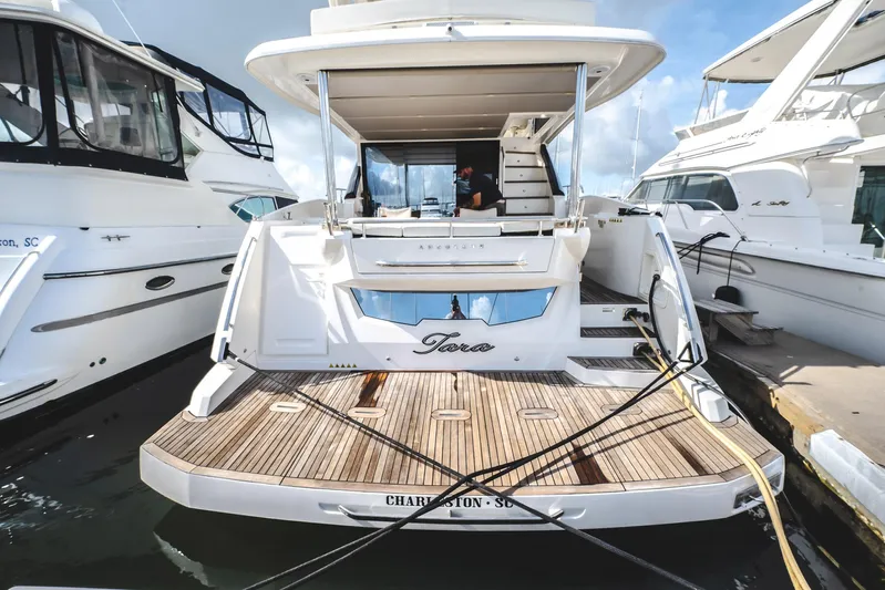 Tara Yacht Photos Pics 2017 Absolute 50 Fly yacht docked, featuring spacious deck and modern design.