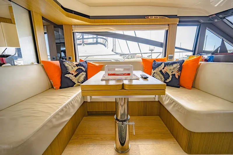 Tara Yacht Photos Pics Luxurious interior of 2017 Absolute 50 Fly yacht with elegant seating and vibrant cushions.