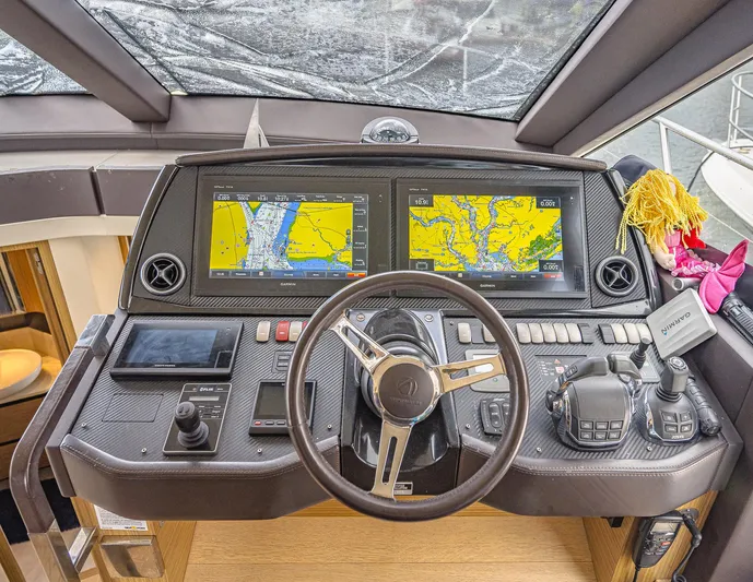 Tara Yacht Photos Pics Cockpit of 2017 Absolute 50 Fly yacht with navigation screens and controls.