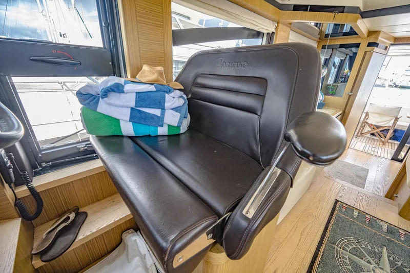 Tara Yacht Photos Pics Luxurious interior of 2017 Absolute 50 Fly yacht with leather seating and nautical decor.