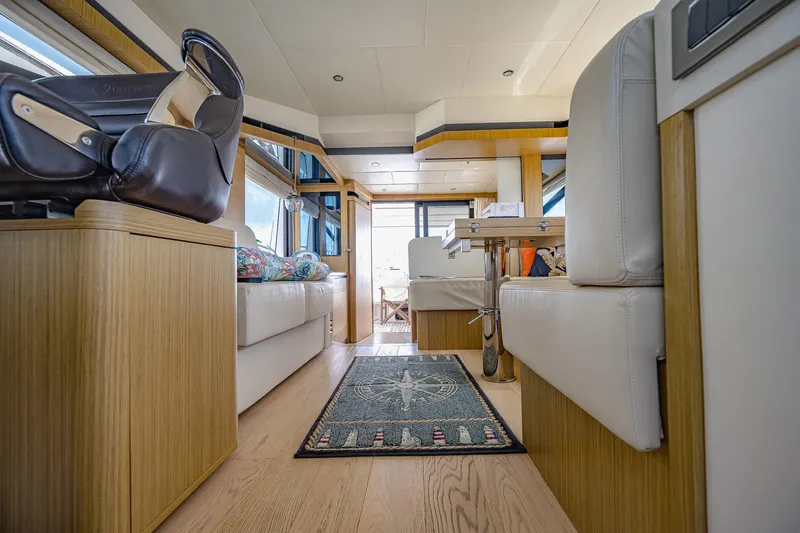 Tara Yacht Photos Pics Luxurious interior of 2017 Absolute 50 Fly yacht with modern seating and elegant decor.