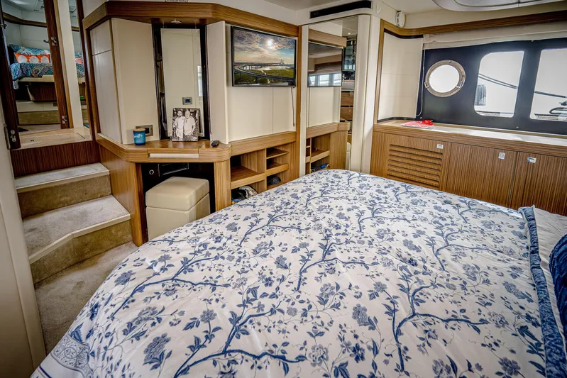 Tara Yacht Photos Pics Luxurious bedroom interior of 2017 Absolute 50 Fly yacht with elegant decor and natural light.