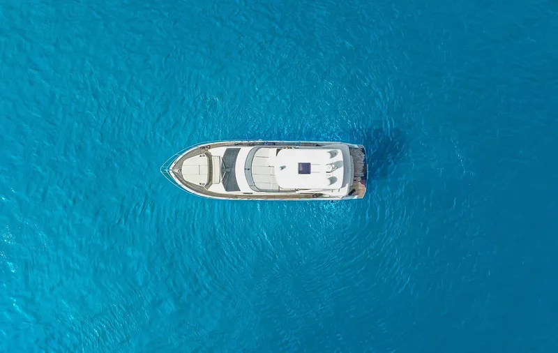 Tara Yacht Photos Pics Aerial view of 2017 Absolute 50 Fly yacht on clear blue water.