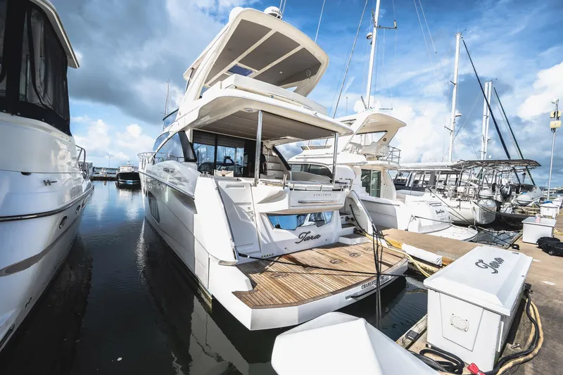 Tara Yacht Photos Pics Luxury yacht Absolute 50 Fly 2017 docked at marina under blue sky.