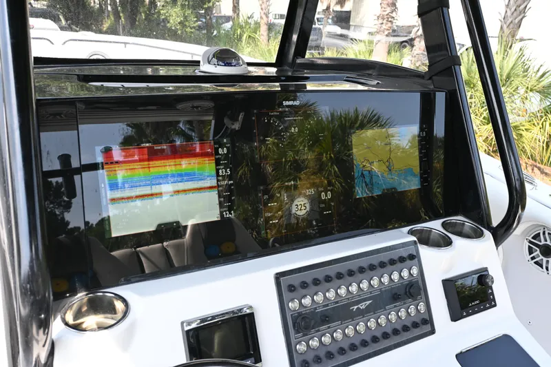  Yacht Photos Pics Tidewater 320 CC Adventure 2020 dashboard with advanced navigation and sonar displays.