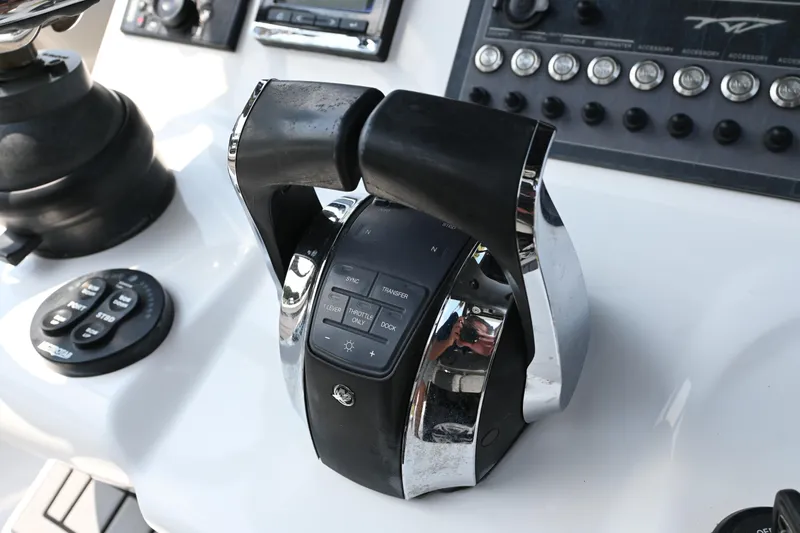  Yacht Photos Pics Control panel of 2020 Tidewater 320 CC Adventure boat with throttle and buttons.