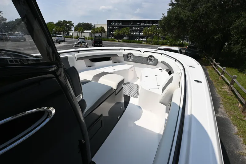  Yacht Photos Pics 2020 Tidewater 320 CC Adventure boat interior with seating and storage compartments.