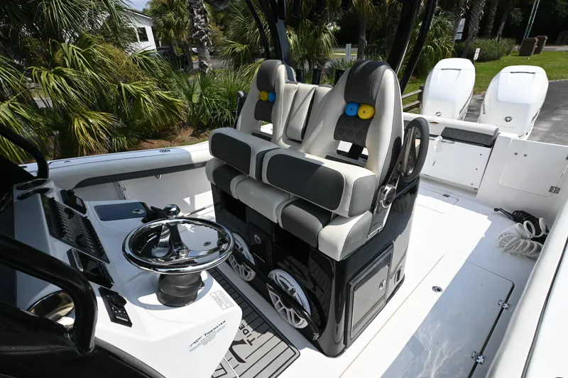  Yacht Photos Pics 2020 Tidewater 320 CC Adventure boat interior with dual seats and steering wheel.