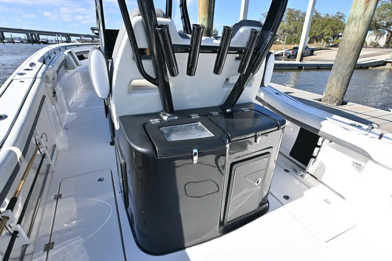  Yacht Photos Pics 2020 Tidewater 320 CC Adventure boat interior with fishing rod holders and storage compartments.