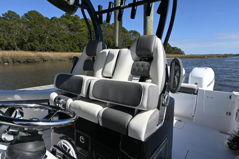  Yacht Photos Pics 2020 Tidewater 320 CC Adventure boat interior with dual helm seats and steering wheel.