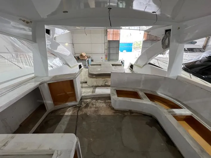  Yacht Photos Pics Interior view of 2023 Custom KAITOS 68 yacht under construction in a workshop.