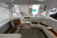 Interior view of 2023 Custom KAITOS 68 yacht under construction in a workshop.