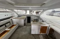 Interior view of a 2023 Custom KAITOS 68 yacht under construction in a shipyard.