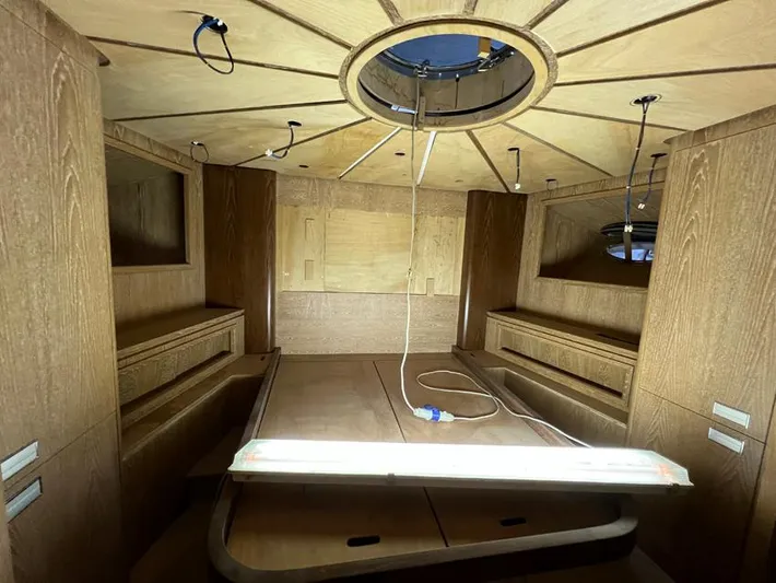  Yacht Photos Pics Interior of 2023 Custom KAITOS 68 yacht, featuring wooden paneling and modern design elements.