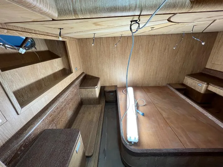  Yacht Photos Pics Interior of 2023 Custom KAITOS 68 yacht with wooden furnishings and ambient lighting.