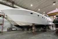 Custom KAITOS 68 yacht under construction in a spacious indoor facility, 2023 model.