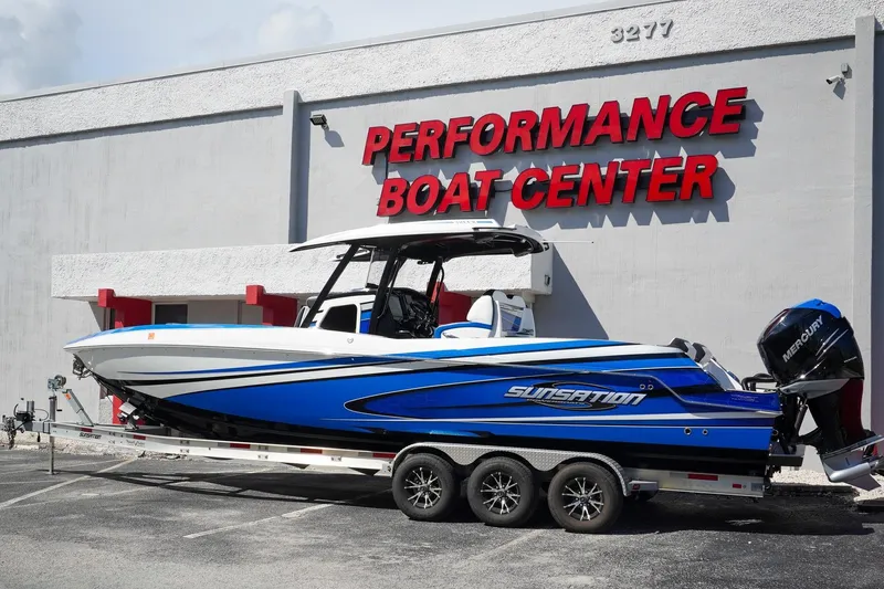 Never Enough Yacht Photos Pics 2023 Sunsation 32 CCX boat at Performance Boat Center, featuring sleek blue design.