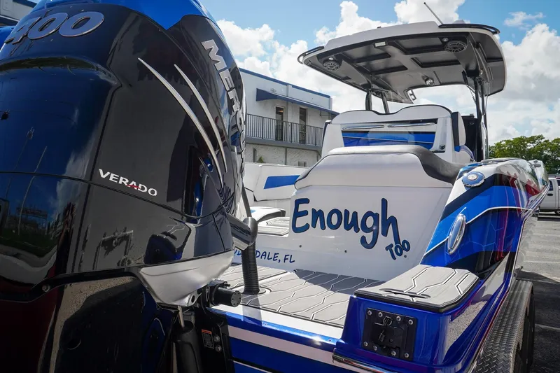 Never Enough Yacht Photos Pics 2023 Sunsation 32 CCX boat with Mercury Verado engine, blue and white design.