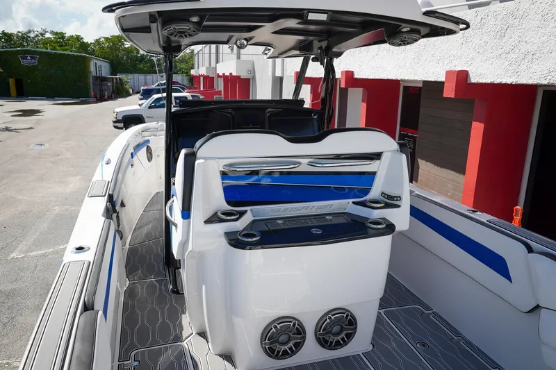 Never Enough Yacht Photos Pics 2023 Sunsation 32 CCX boat interior with modern seating and sleek design.