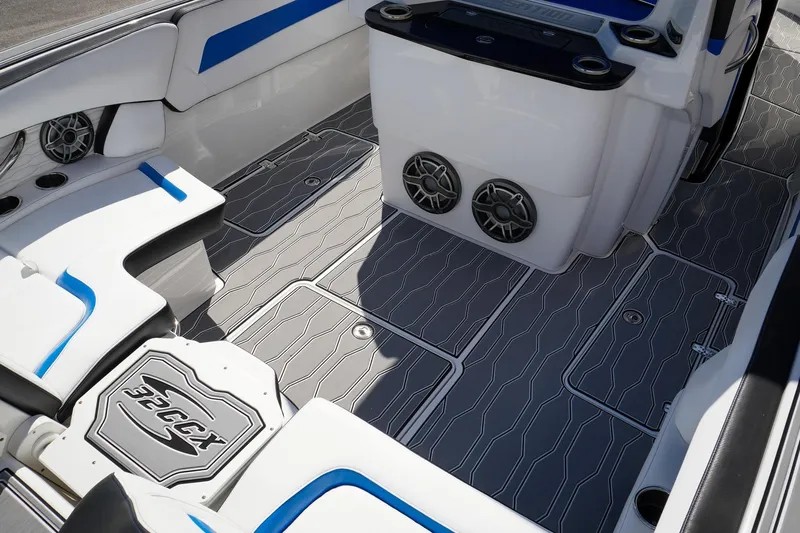 Never Enough Yacht Photos Pics 2023 Sunsation 32 CCX boat interior with stylish seating and modern audio system.