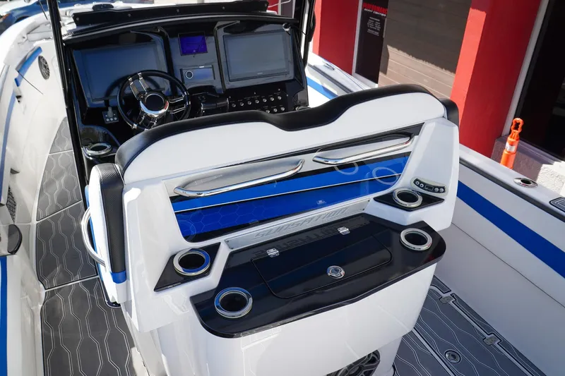 Never Enough Yacht Photos Pics 2023 Sunsation 32 CCX boat cockpit with modern controls and sleek design.