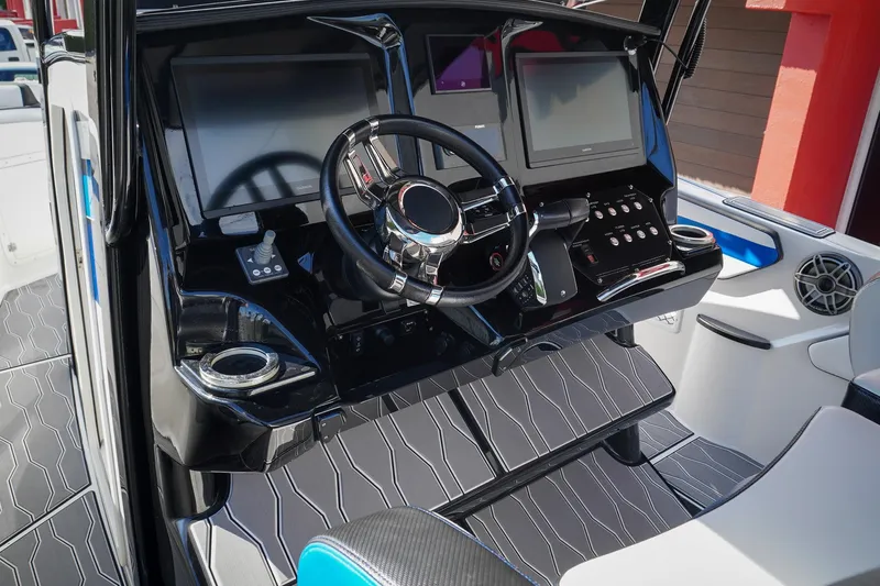 Never Enough Yacht Photos Pics 2023 Sunsation 32 CCX boat dashboard with modern controls and dual screens.