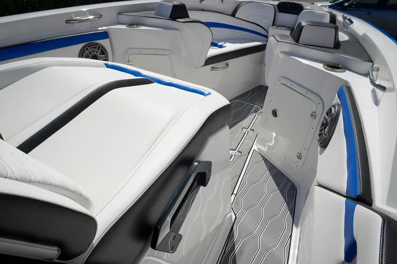 Never Enough Yacht Photos Pics 2023 Sunsation 32 CCX boat interior with sleek seating and modern design elements.