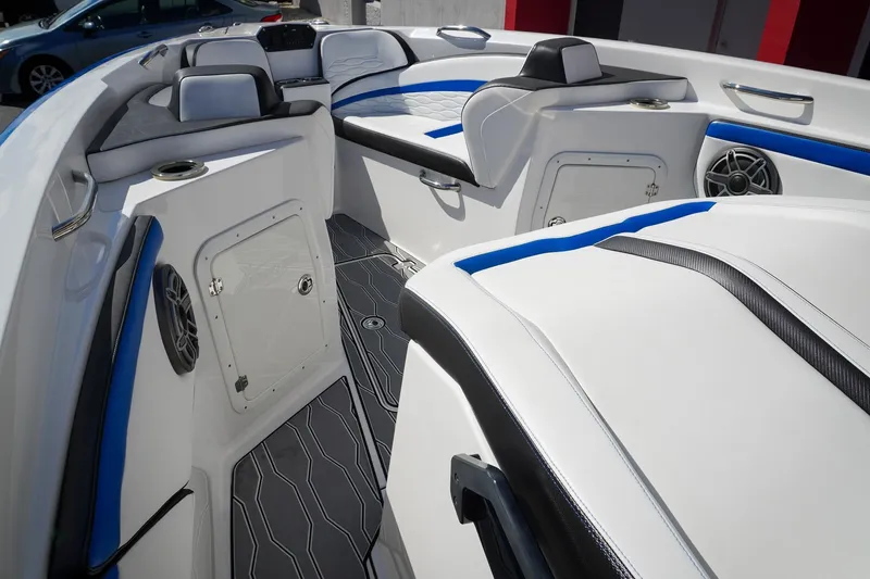 Never Enough Yacht Photos Pics 2023 Sunsation 32 CCX boat interior with sleek seating and modern design elements.
