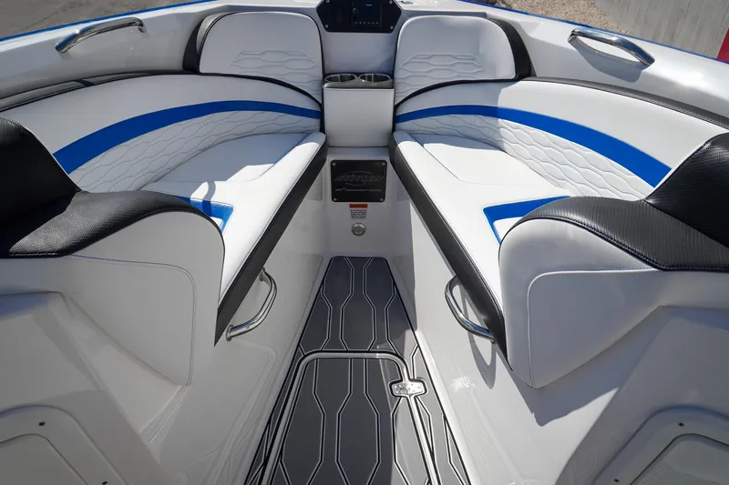 Never Enough Yacht Photos Pics 2023 Sunsation 32 CCX boat interior with white and blue seating, modern design.