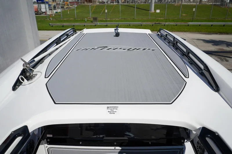 Never Enough Yacht Photos Pics 2023 Sunsation 32 CCX boat deck with sleek design and logo detailing.