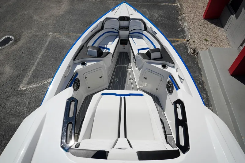 Never Enough Yacht Photos Pics 2023 Sunsation 32 CCX boat interior with sleek seating and modern design.